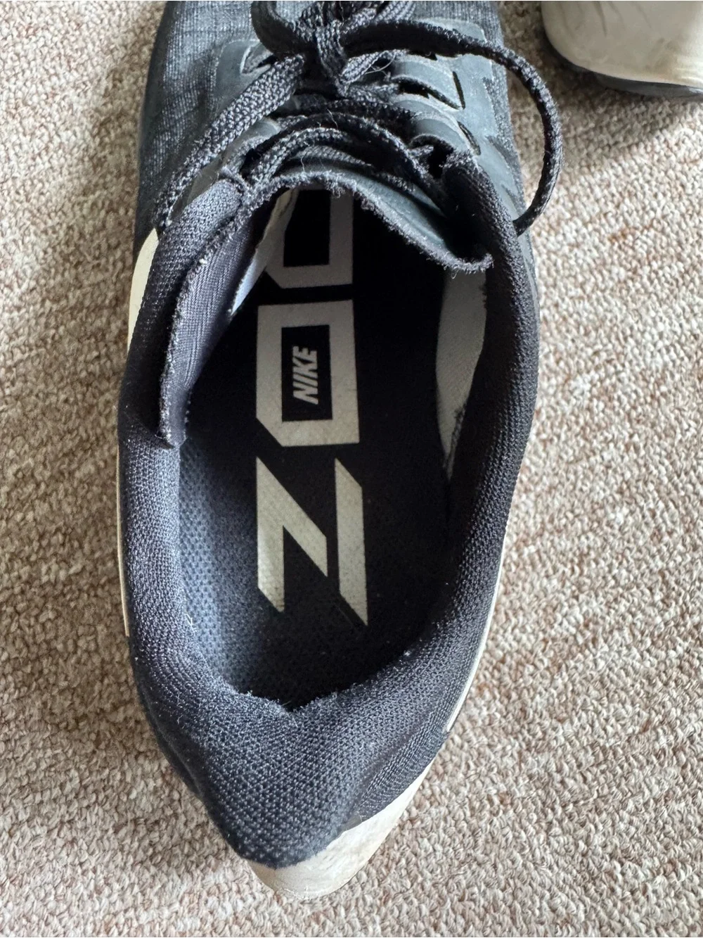Nike Black Athletic Running Shoes with White Swoosh